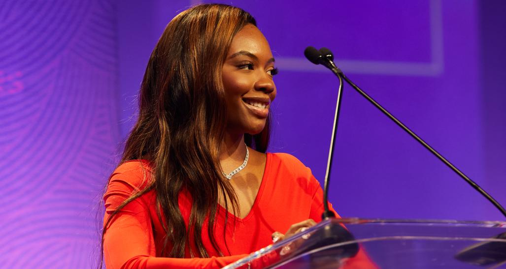 2022 NRF Foundation Honors Amaiya Sims onstage introducing 2021 finalists